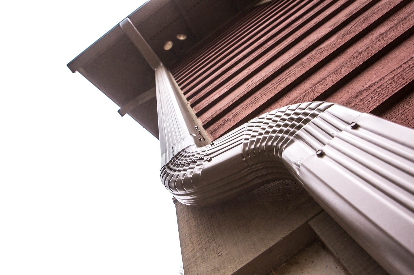 gutter downspout on the side of a home