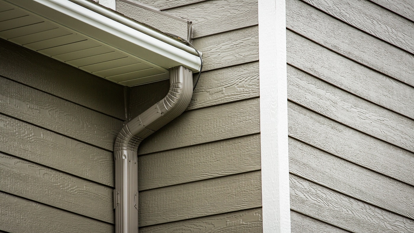 New gutters and siding installed on Roberts, WI home