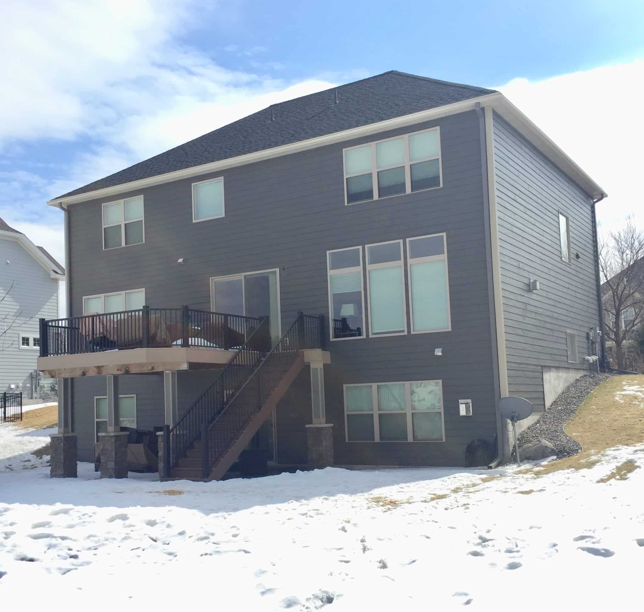 after home has gray lp siding installed by Lindus Construction 
