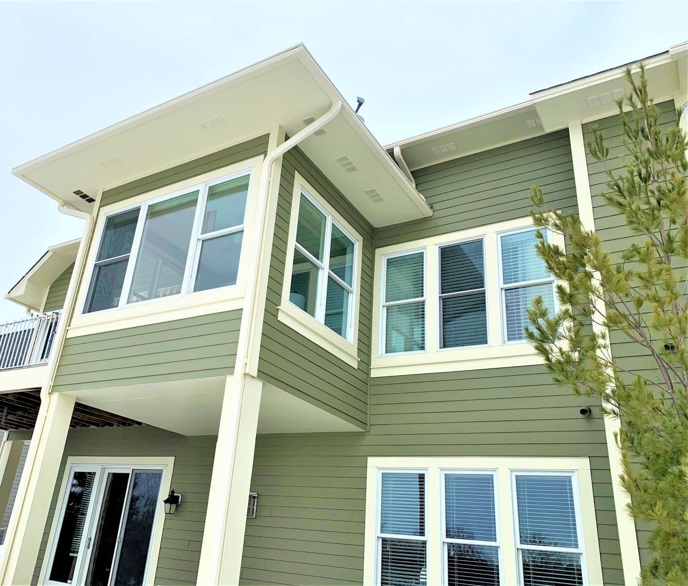 Green Plymouth home with LeafGuard Gutters 