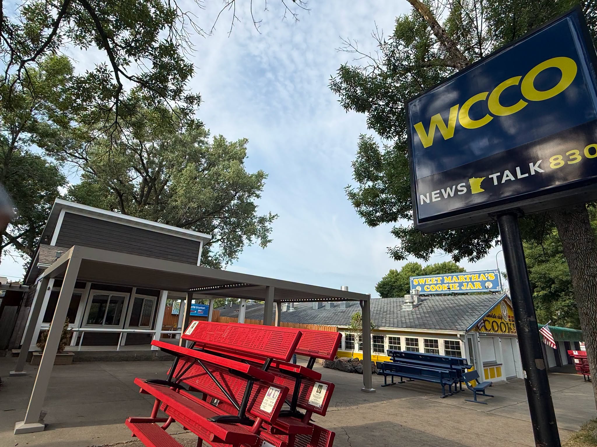 Completed StruXure Pergola X at the WCCO Radio booth at the Minnesota State Fair, with adjustable louvers covering the outdoor seating area.